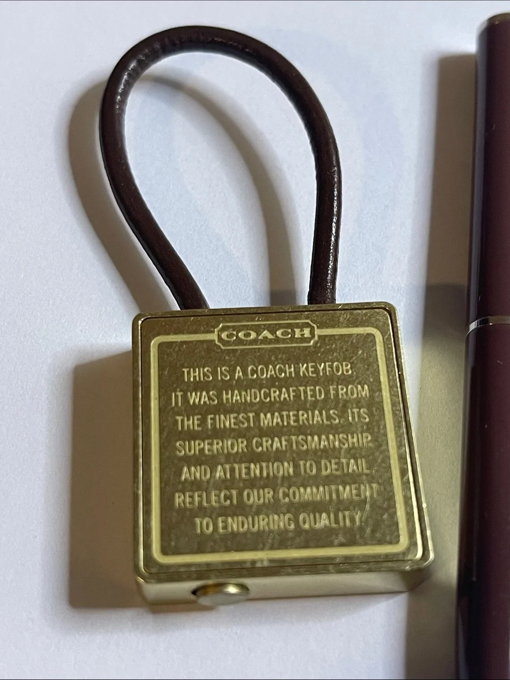 Coach Gold-Tone Brass Key Fob with Brown Leather Loop and Coach Pen